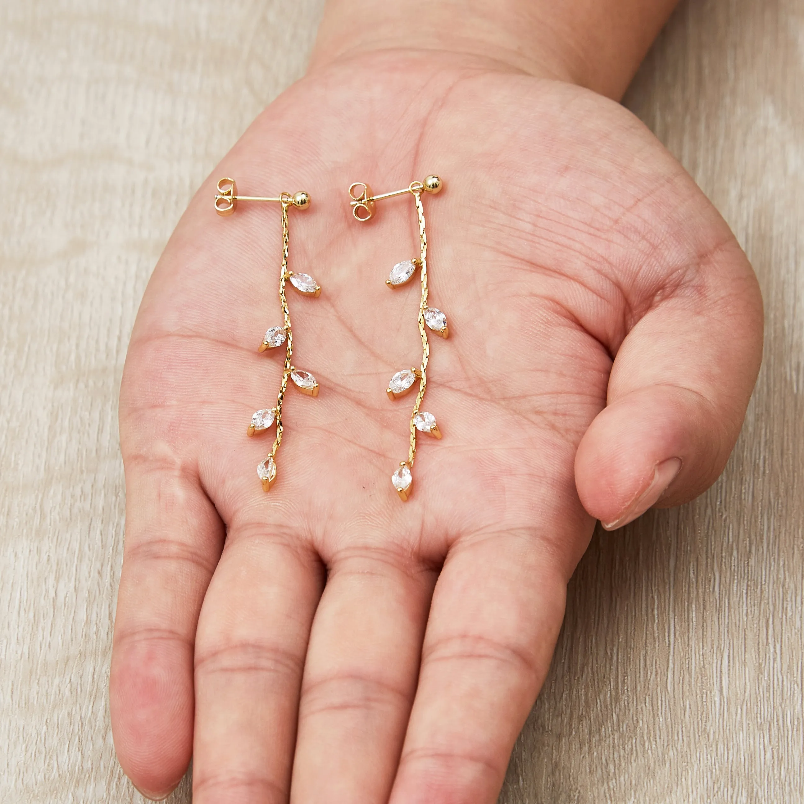 Gold Plated Leaf Dangle Earrings Created with Zircondia® Crystals