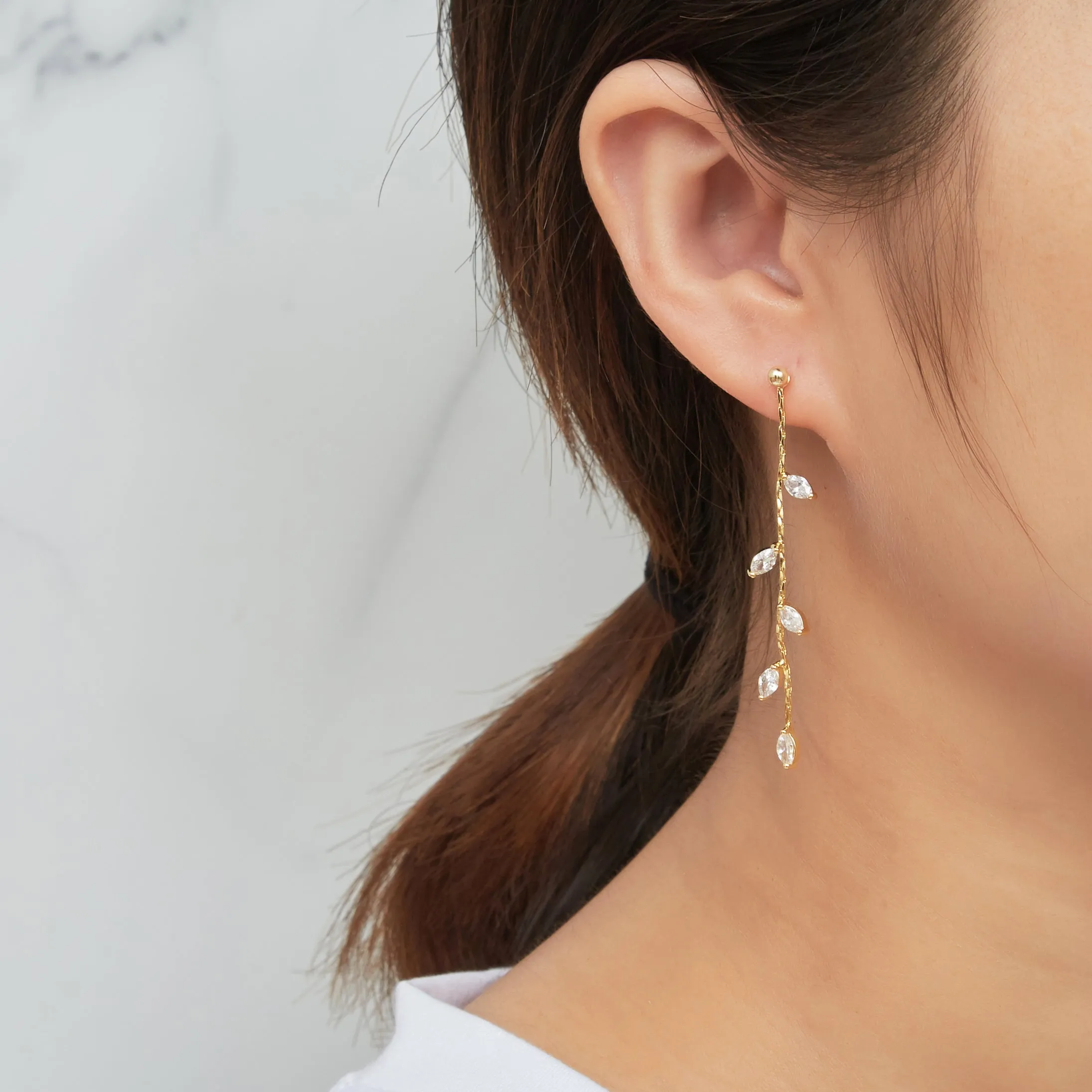 Gold Plated Leaf Dangle Earrings Created with Zircondia® Crystals